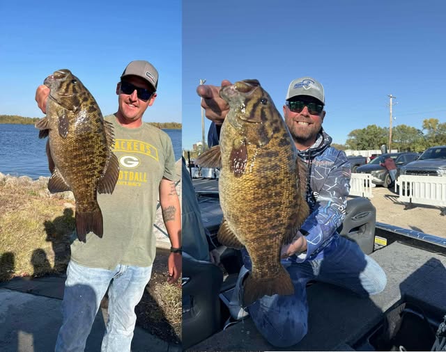 Chris Miller (right) caught the same lunker Casey Goode weighed in last year.